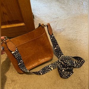 Brown crossbody purse with leopard strap